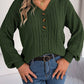 Cozy green Henley cable knit sweater paired with a black belt and jeans