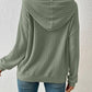 Green ribbed hoodie, perfect for casual or lounge wear.
