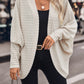 Ivory layering batwing sleeve cardigan with a relaxed drape and ribbed texture