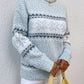 Cozy pastel blue snowflake knit sweater, ideal for winter layering and festive holiday outings.

