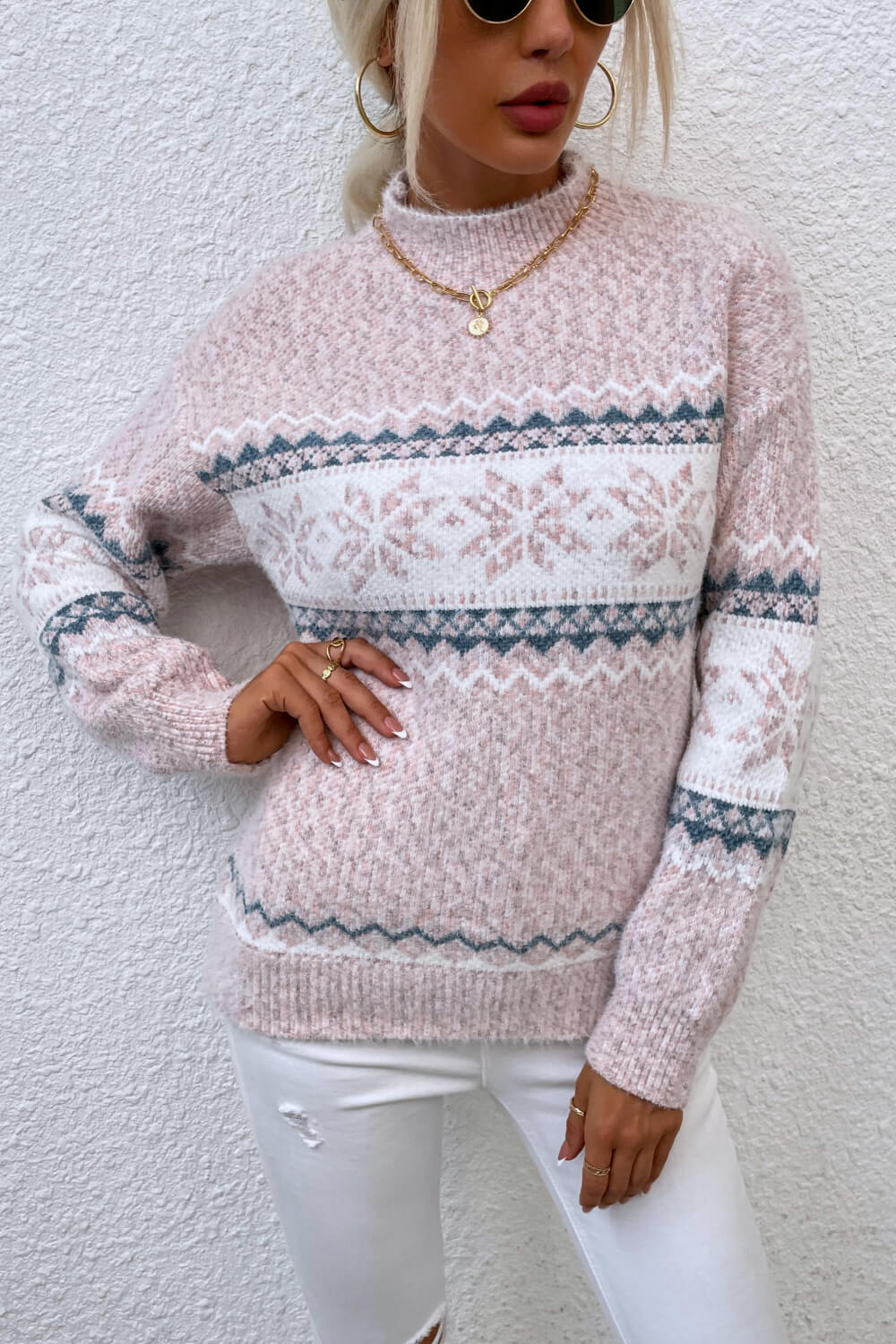 Cozy pink snowflake knit sweater, ideal for festive winter gatherings and everyday wear.

