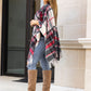 Cozy red plaid shawl with black and white accents.