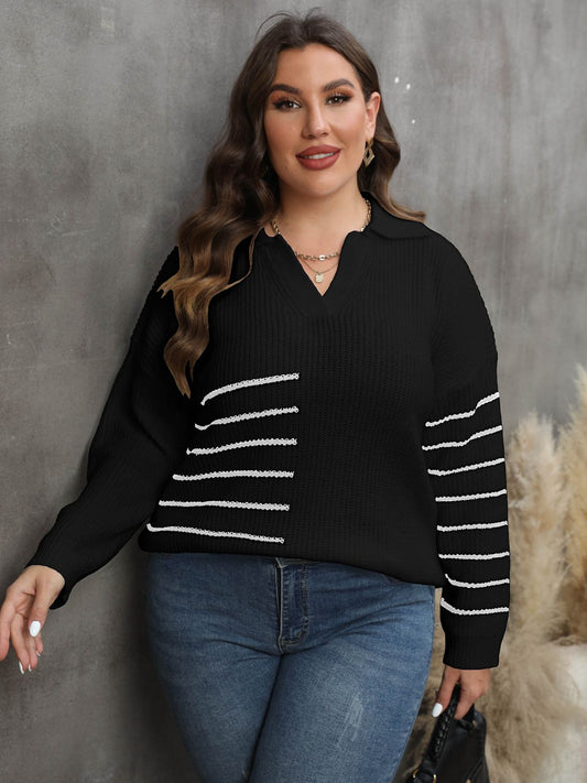 Cozy black pullover sweater with white stripes on the sleeve, styled for plus-size comfort