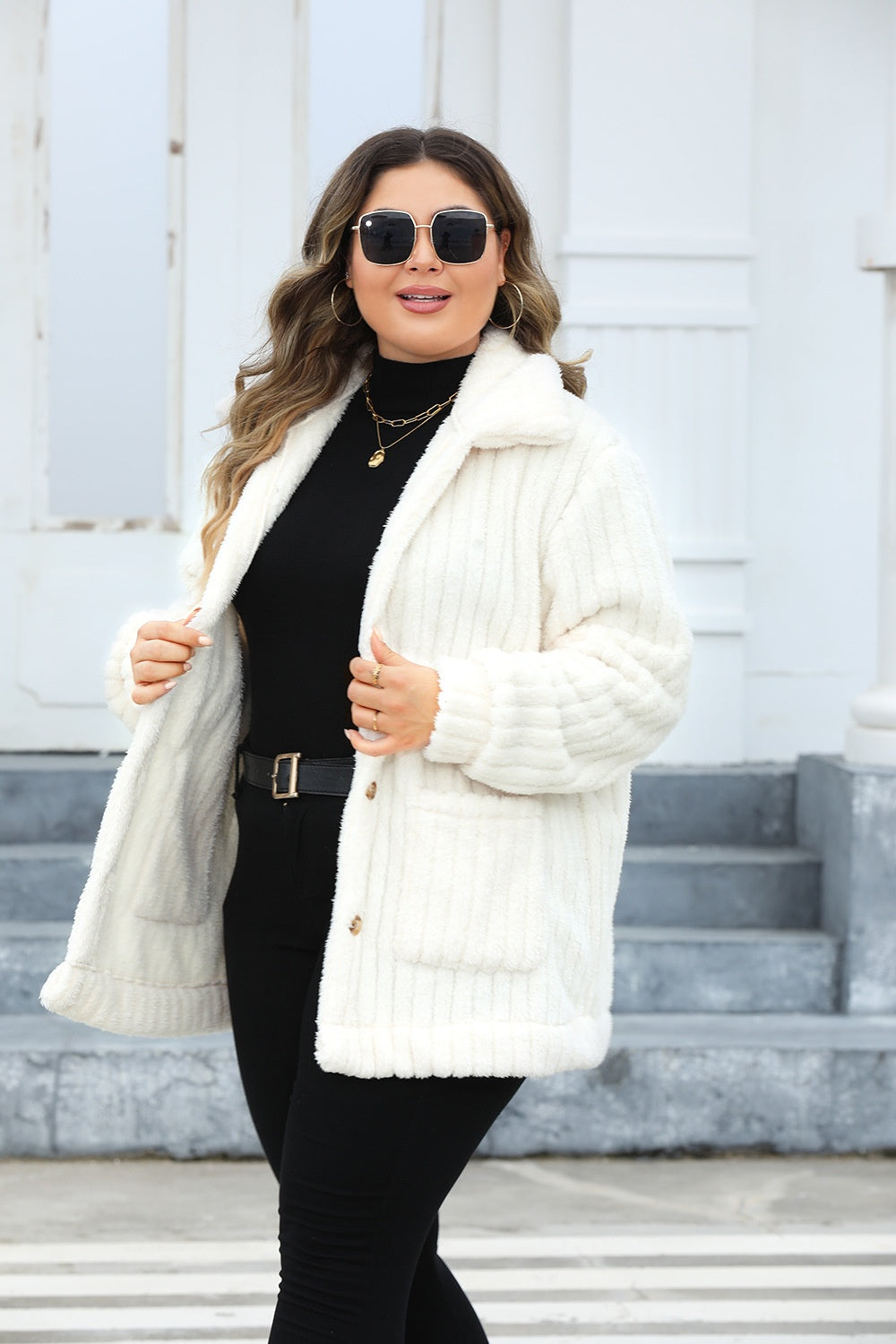 Women's plus size sherpa jacket with a button-up closure for easy styling.
