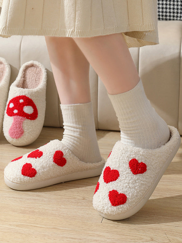 Soft cotton-blend slippers featuring a whimsical red heart pattern
