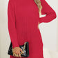 Longline red turtleneck sweater with side slits for added style.
