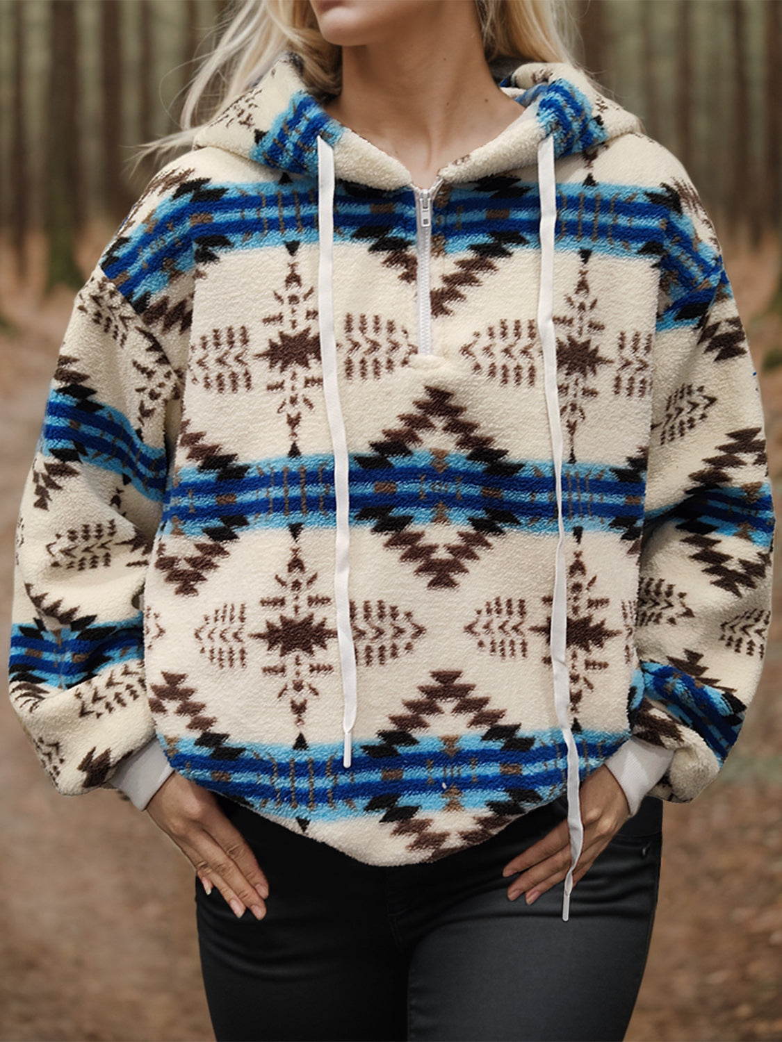 Cozy fleece hoodie with a Southwestern-inspired geometric print for women.