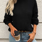 Black mock neck sweater with cozy texture, shown styled casually
