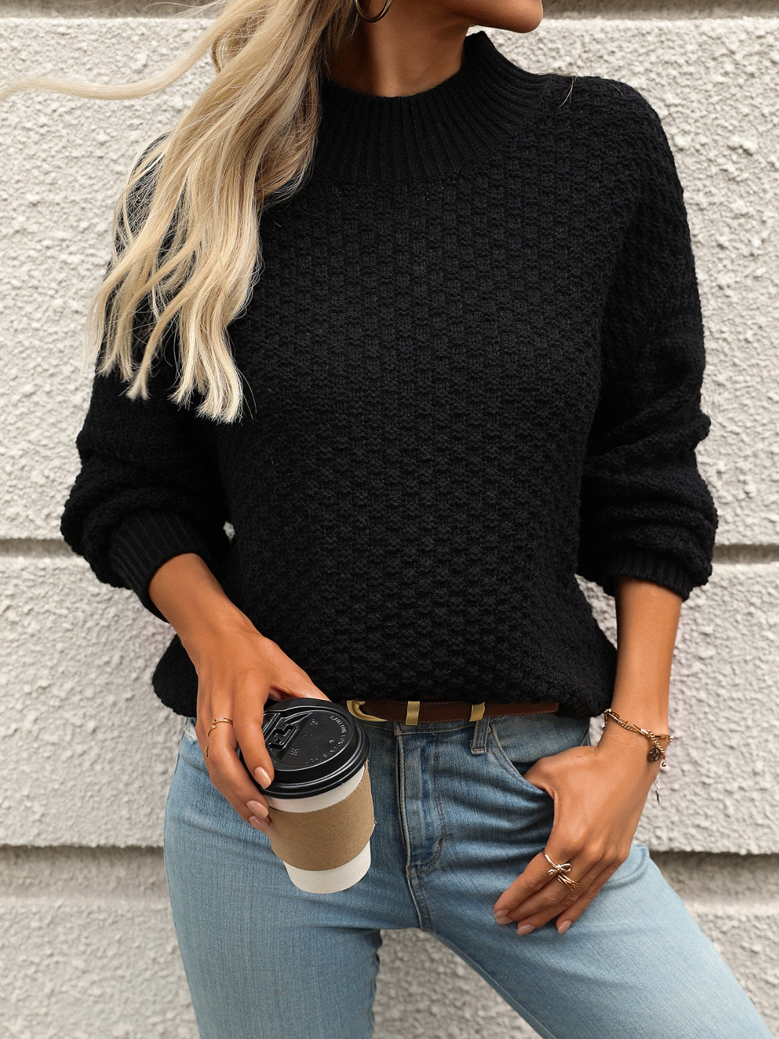 Black mock neck sweater with cozy texture, shown styled casually
