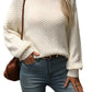 Cream mock neck sweater with cozy texture, shown styled casually
