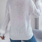 Classic white cable knit sweater with buttons, perfect for fall and winter wear.
