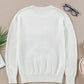 Cozy white sweater with a festive tinsel "Merry & Bright" design, great for spreading Christmas cheer in style.

