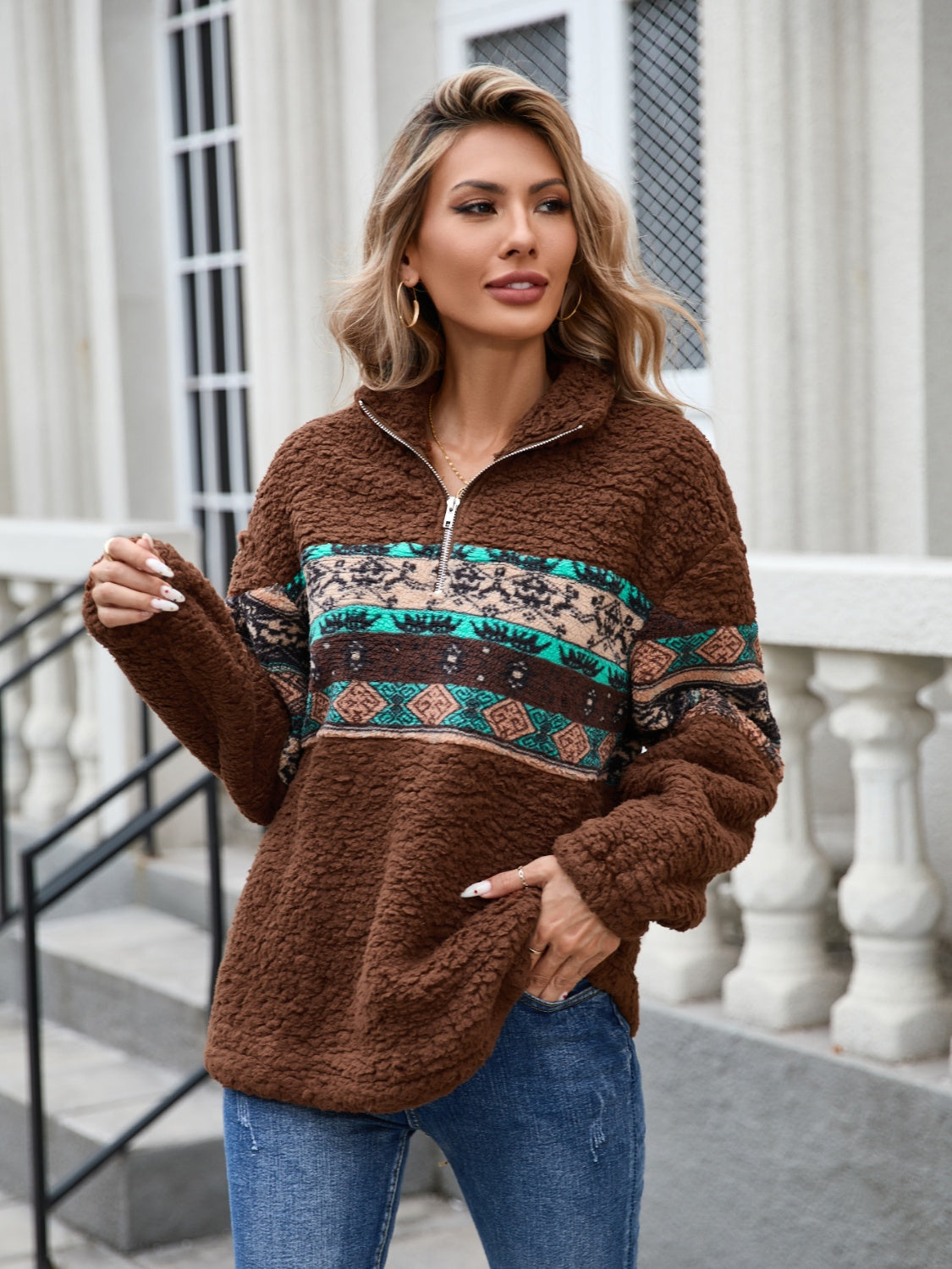 Boho-style brown fleece sweatshirt with colorful Aztec accents.
