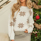 Full view of an ivory snowflake sweater, perfect for staying warm and stylish during the holiday season.