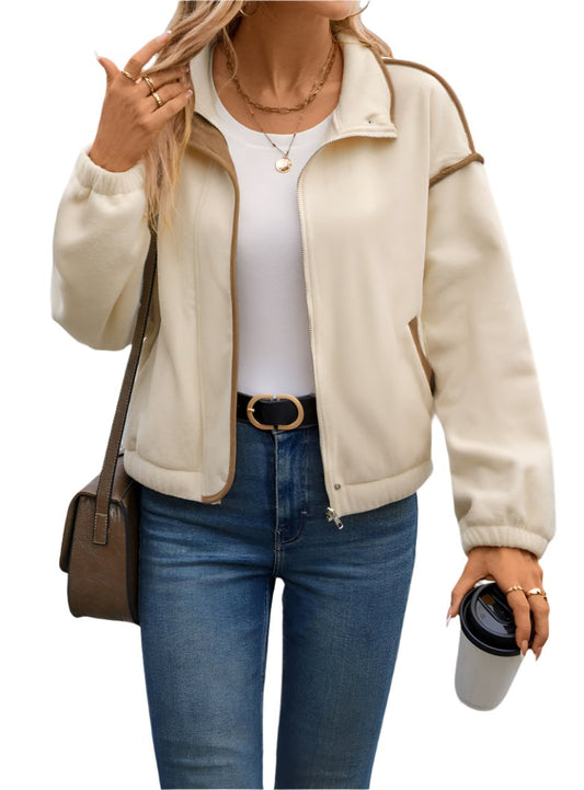 Front view of cream buttoned zip-up jacket with pockets
