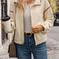 Everyday wear cream jacket with buttoned and zippered closures
