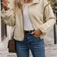 Fall layering look with cream buttoned zip-up jacket
