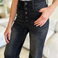 High waist denim with button fly closure, cropped leg style.