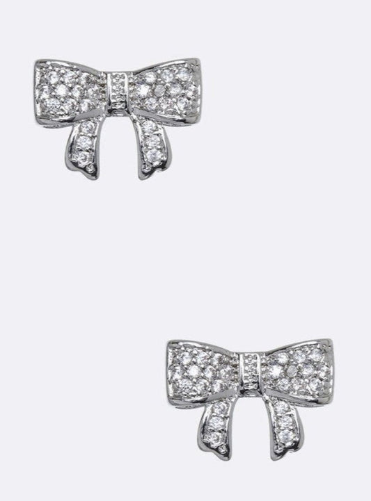 Pair of cubic zirconia bow stud earrings with a rhodium finish