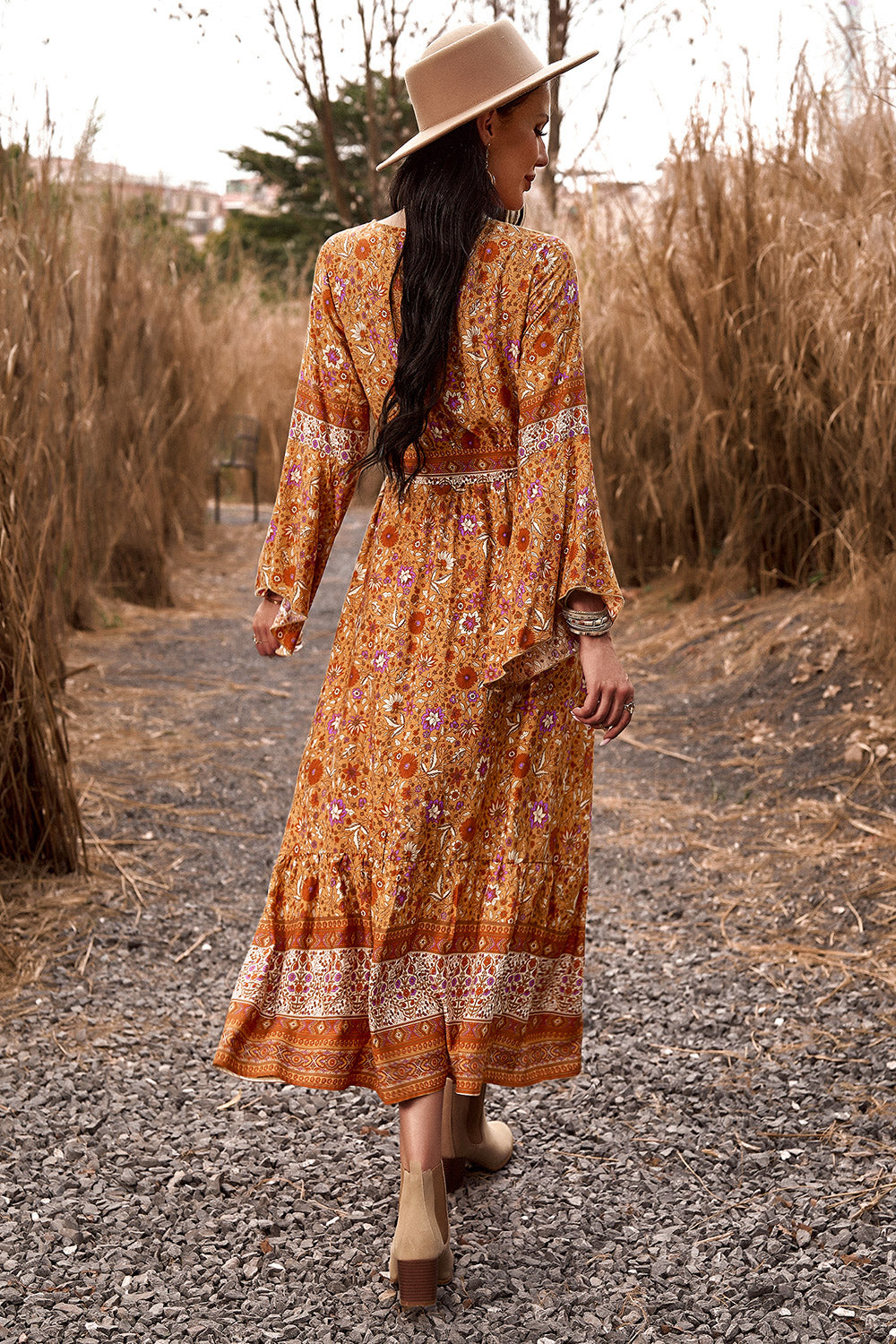 Elegant floral-patterned Boho Maxi Dress with long, flowy sleeves.