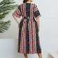 Colorful print plus-size midi dress with V-neck and short sleeves