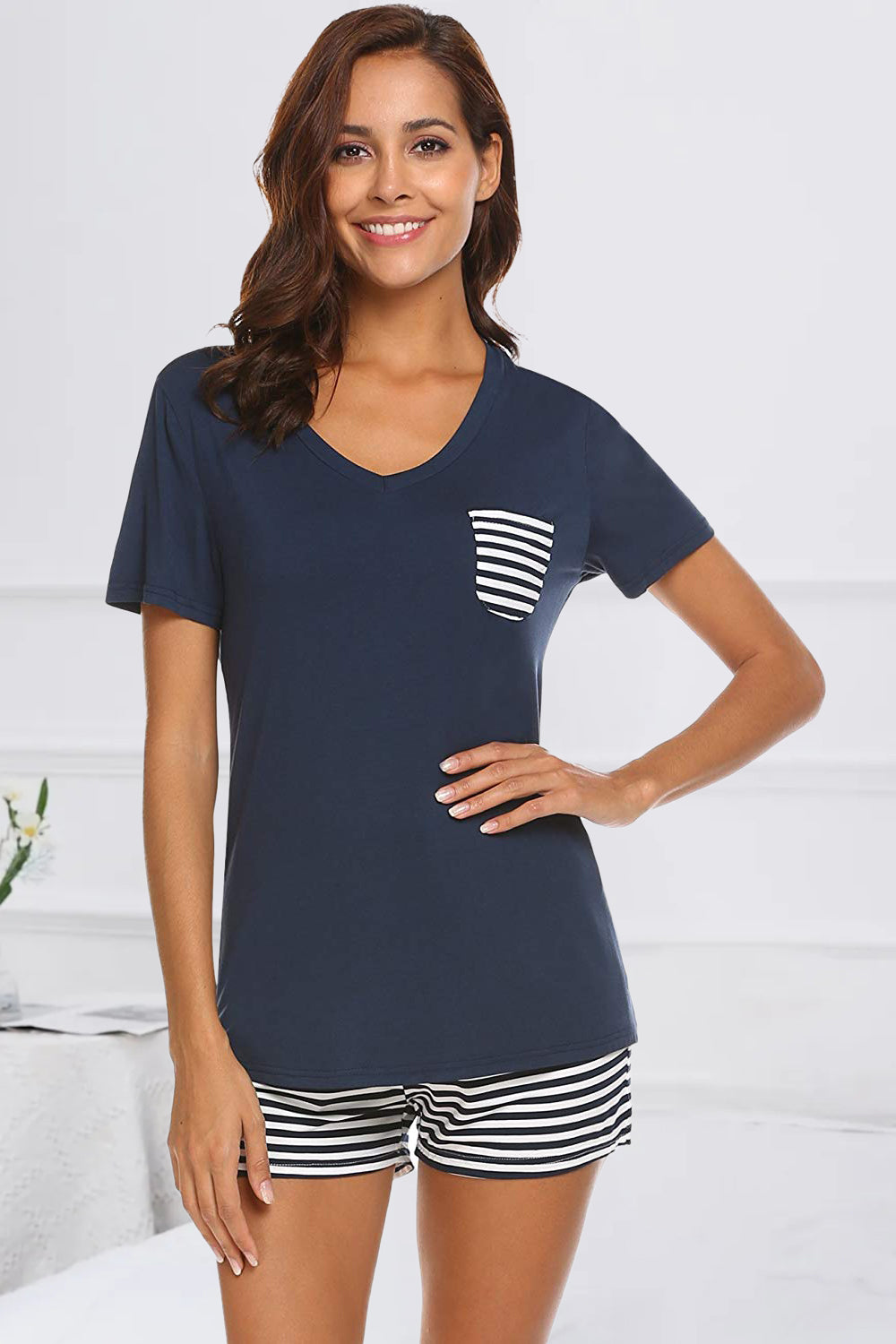 Unwind in style with our chic Striped Short Sleeve Top and Shorts Lounge Set. Soft, breathable fabric meets effortless elegance for ultimate comfort.