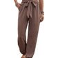 Brown boho chic drawstring pants with elastic cuffs.