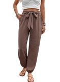 Brown boho chic drawstring pants with elastic cuffs.