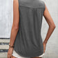 Gray sleeveless top with lace detailing and buttons.