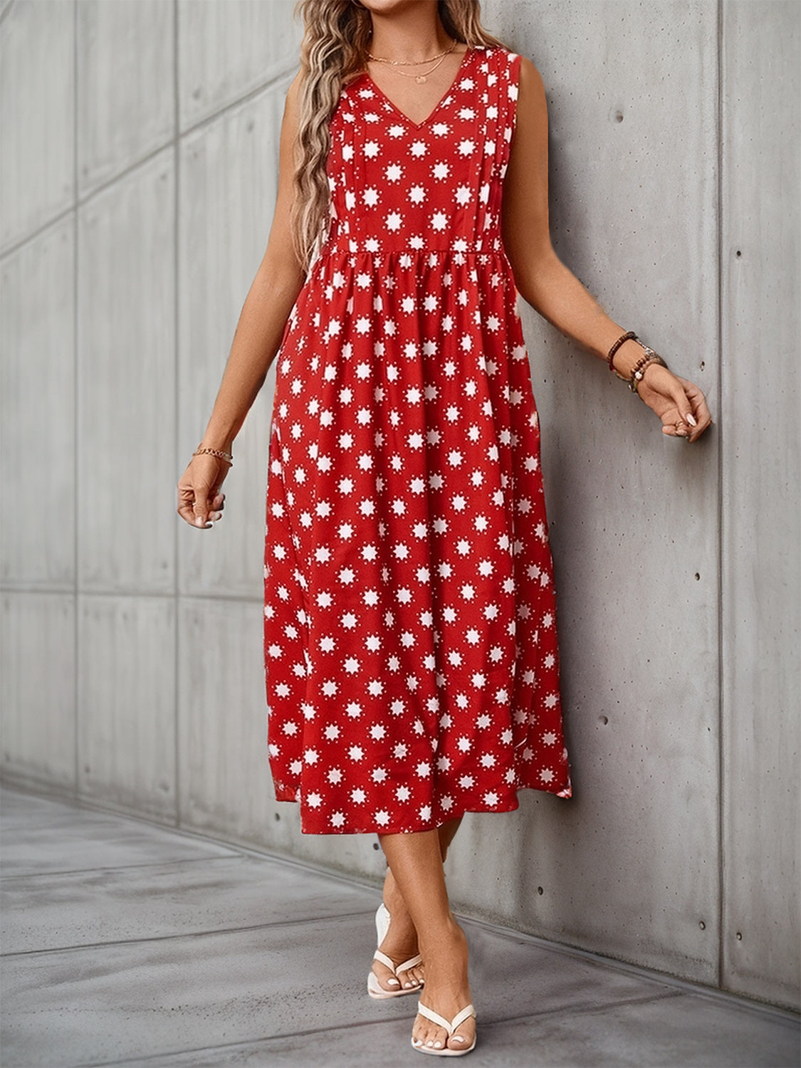 Sleeveless red dress adorned with white daisy motifs