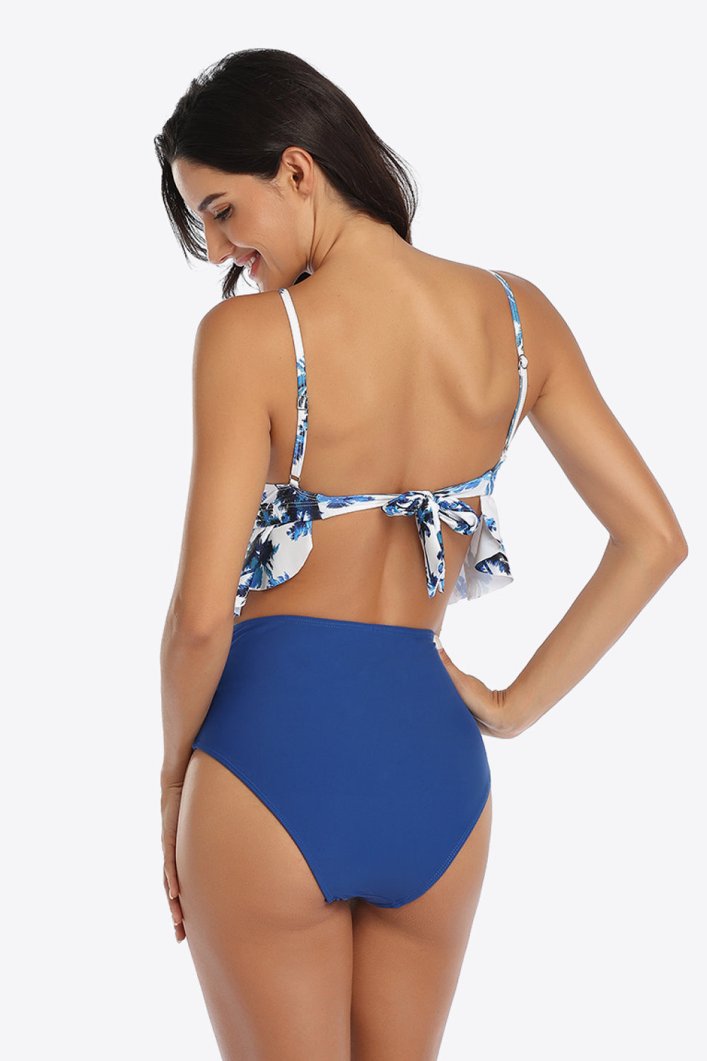 Dive into style with our Tropical Print Ruffled Two-Piece Swimsuit. Perfect fit, vibrant colors, and ultimate comfort for your sunny getaways.
