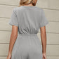 Stylish & comfy drawstring romper with button detail and pockets, perfect for any casual chic occasion