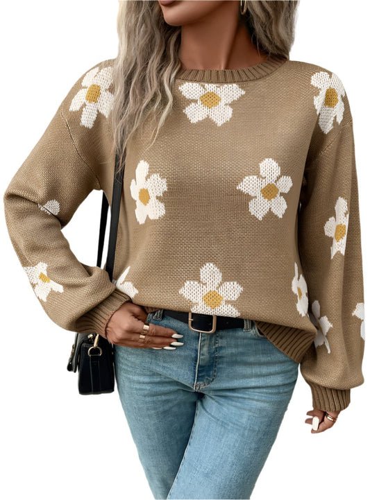 Daisy pattern knit sweater styled casually with jeans for a cozy look