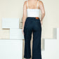 Wide-leg Judy Blue jeans styled with neutral heels for a chic look.
