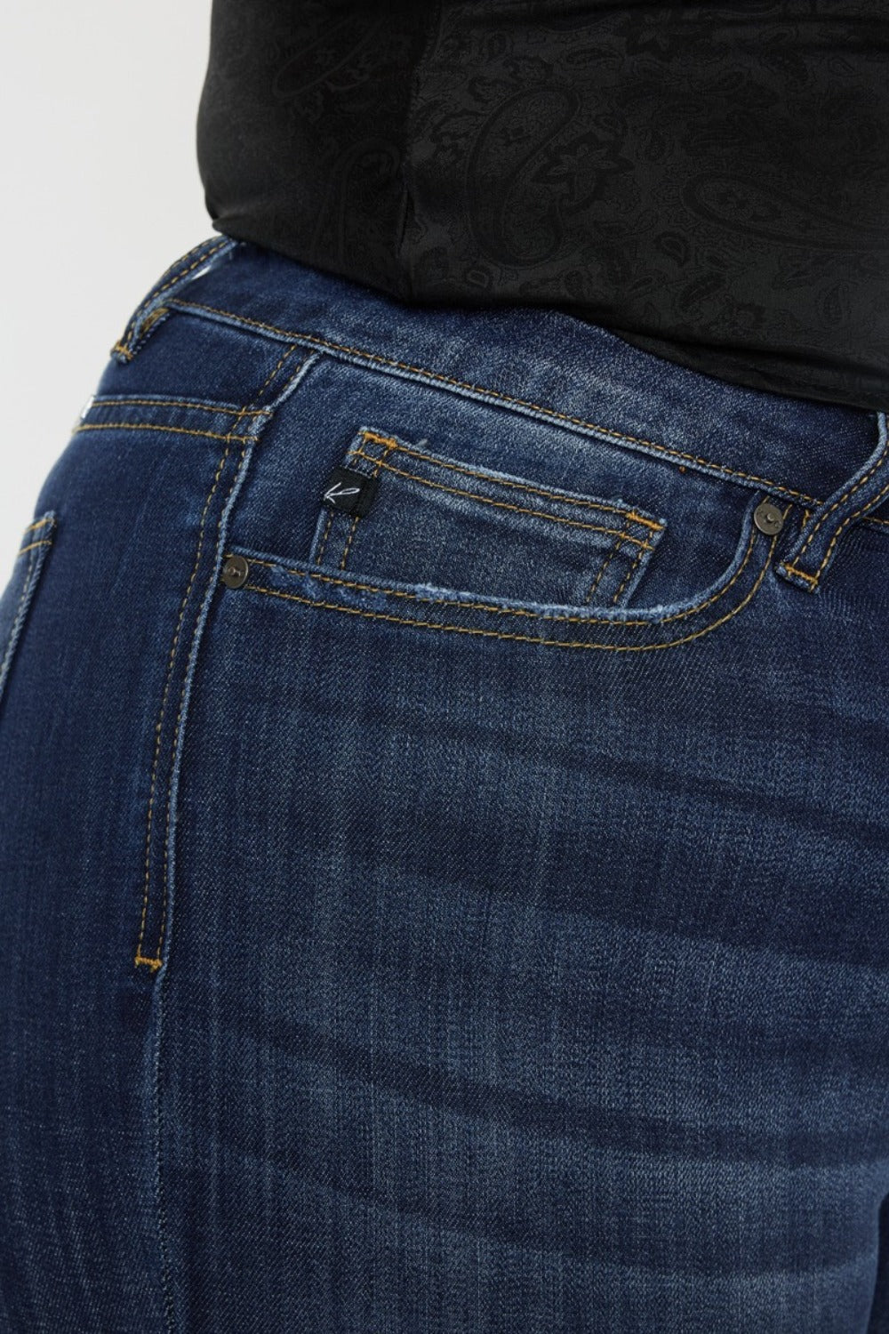 Close-up of dark wash Kancan flare jeans with slight stretch
