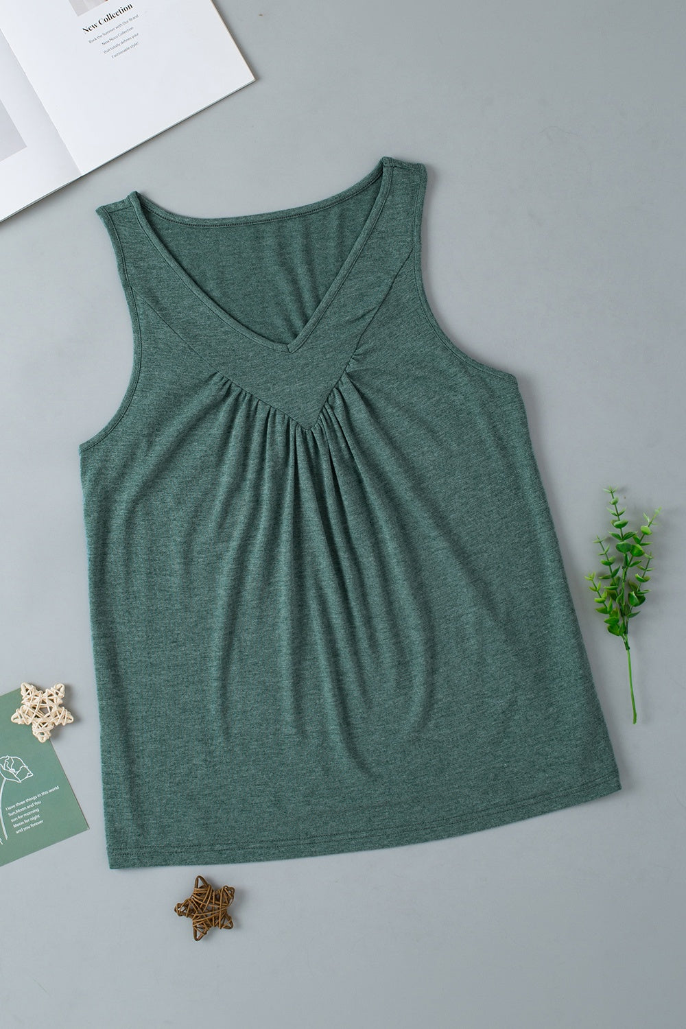 Green sleeveless top with gathered V-neckline