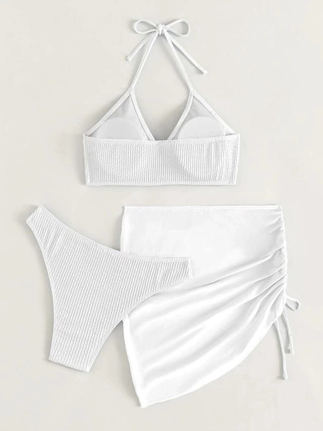 Check out our chic white bathing suit. Adjustable, stylish, and perfect for any beach day or poolside escape.