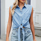 Chic light wash denim sleeveless top with front knot and chest pocket, great for a variety of casual outfit pairings