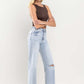 High-rise flare leg jeans in light wash for a vintage look
