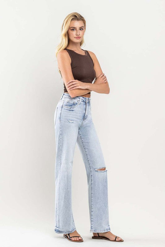 High-rise flare leg jeans in light wash for a vintage look
