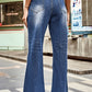 Back view of buttoned loose fit distressed jeans with pockets.