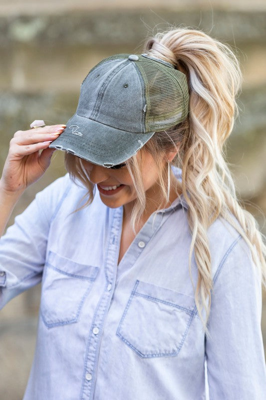 Olive distressed messy bun hat cap with ponytail opening
