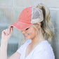 Rust distressed messy bun hat cap with ponytail opening
