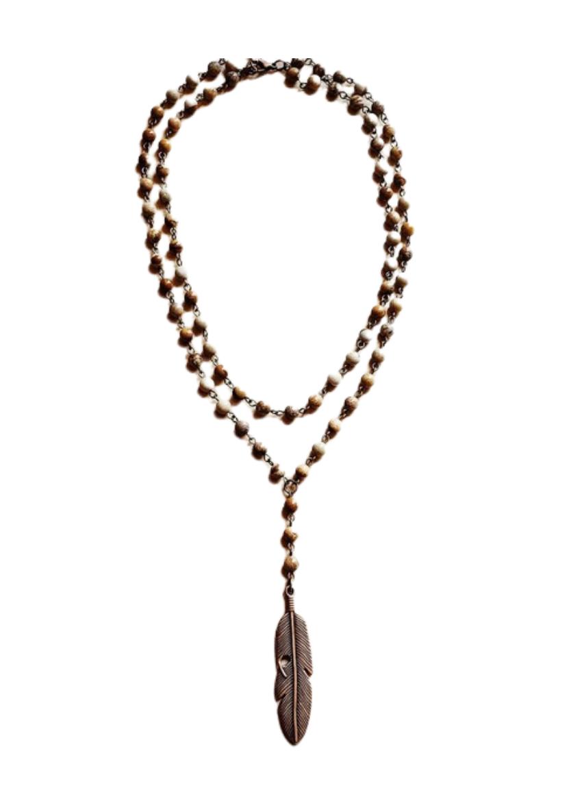 Boho-inspired double-strand jasper necklace featuring a detailed feather pendant.
