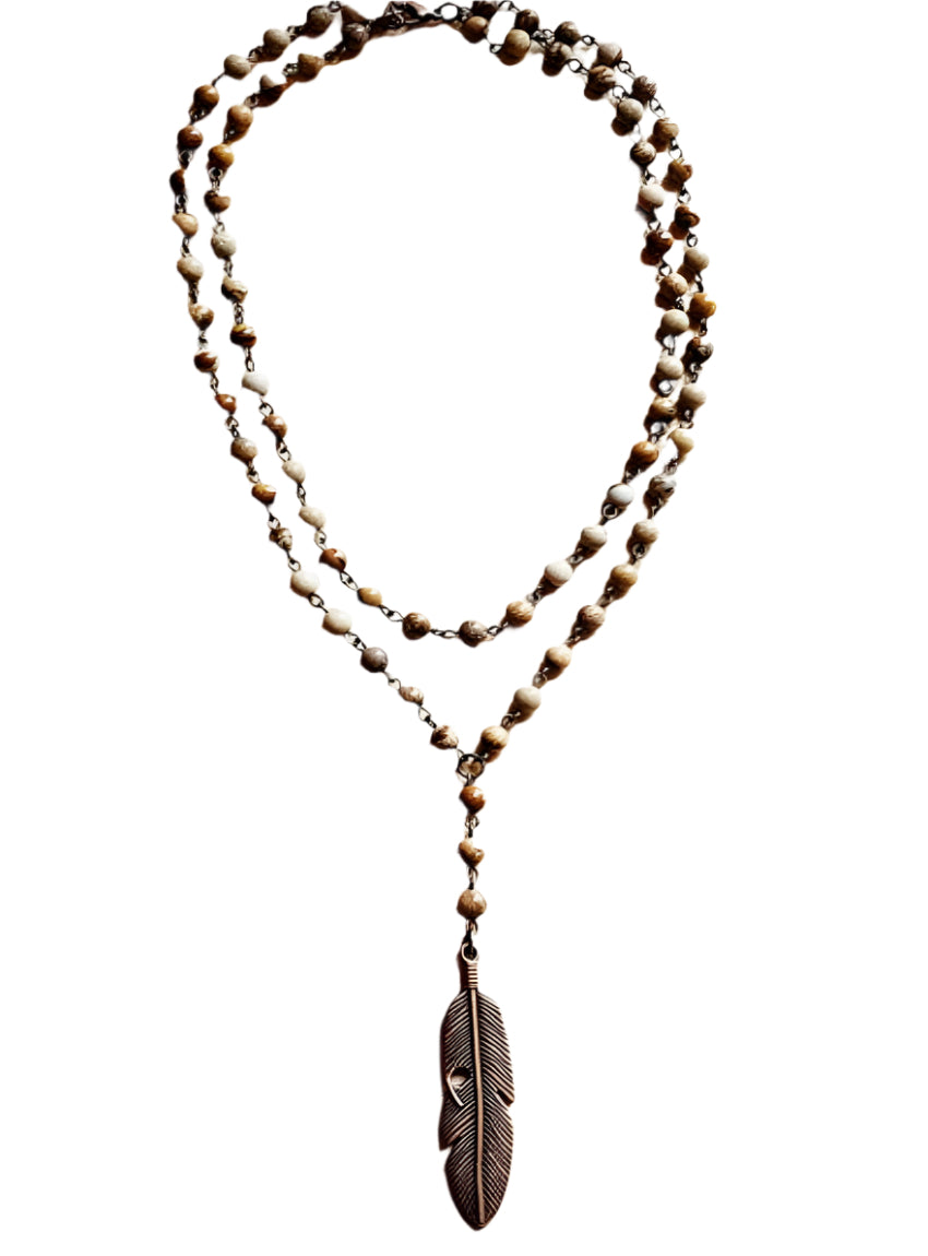 Boho-inspired double-strand jasper necklace featuring a detailed feather pendant.
