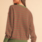 Mocha round-neck sweater with striped pattern and soft fabric.
