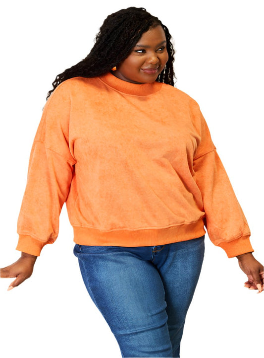 Orange round-neck sweatshirt with dropped shoulders and long sleeves for women.
