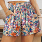 Stylish Floral High Waisted Shorts with pockets perfect for summer. Light fabric, vibrant colors, and versatile design for any occasion.