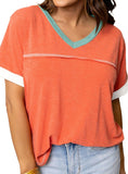 Bright orange tee with aqua V-neck and white sleeve trim.