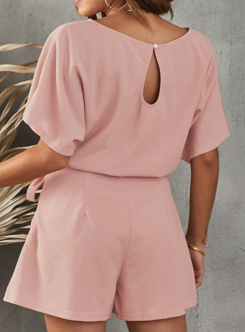 Chic Tie Belt Romper with a flattering fit, perfect for easy styling on warm days or upscale casual events.